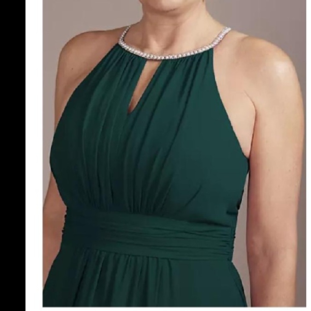 Oleg Cassini, dark green gown.